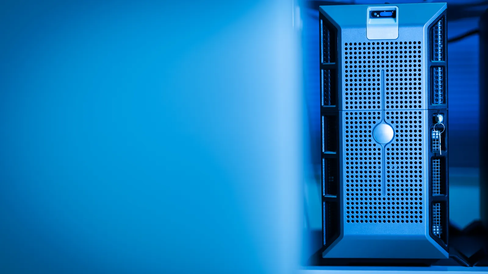 Server hardware illuminated in blue inside a data center